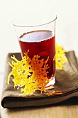 Mimolette cheese crisps with a glass of red wine