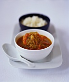 Meatballs in tomato sauce; rice