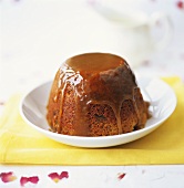 Turned-out chocolate pudding with caramel sauce