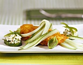 Chicken breast in cheese panade, garnished with cucumber