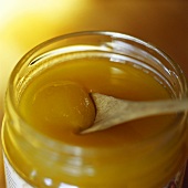Honey in jar with honey spoon