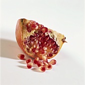 Quarter of a pomegranate and pomegranate seeds