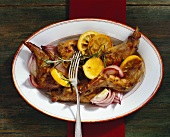 Braised rabbit with lemons and red onions