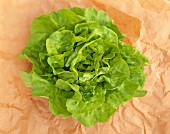 Lettuce on brown paper (overhead view)