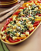 Tomato salad with cheese, olives and pine nuts (Mexico)