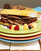Beef sandwich, garnished with fruit