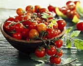 Fresh cherry tomatoes in wooden bowl