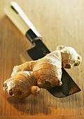 Ginger root with chopping knife