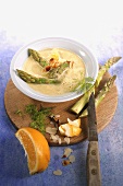 Creamed asparagus soup with flaked almonds