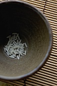 Long-grain rice in brown bowl