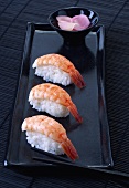 Three nigiri sushi with shrimps