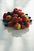Mixed berries on white linen cloth