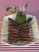 Skewered beef with garlic and herb sauce