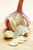 Garlic bulb and clove, partly sliced