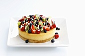 Small cheesecake topped with fruit