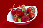 Fresh strawberries in a small bowl