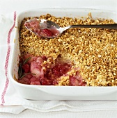Rhubarb and raspberry crumble in baking dish