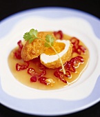 Deep-fried egg on sweet and sour chili sauce