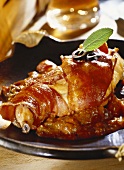 Rabbit with bacon in tomato sauce