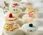 Cup-cakes with glacé icing and decorations