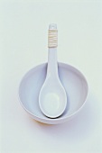 Asian soup spoon in bowl