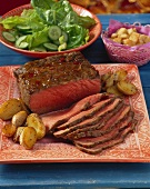 Roast beef with potatoes and shallots