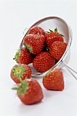 Fresh strawberries with a sieve