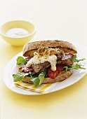 Beef steak and mustard mayonnaise in a sandwich