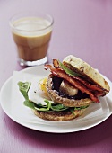 Fried egg, mushroom and bacon in a sandwich