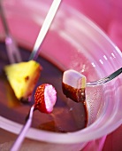Chocolate fondue with fruit and marshmallow