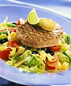 Barbecued tuna steak on salad