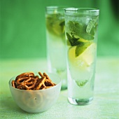 Two glasses of Mojito and salted pretzels