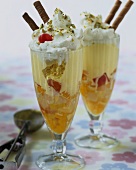 Ice cream sundaes with fruit and whipped cream