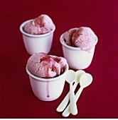Strawberry ice cream in three pots