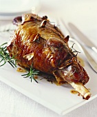 Leg of lamb studded with garlic and rosemary