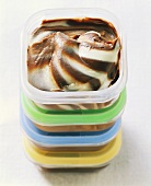 Chocolate and vanilla ice cream in food storage boxes
