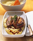Crispy duck breast on polenta with chocolate chili syrup