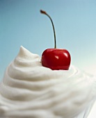 Cream topping with a cherry