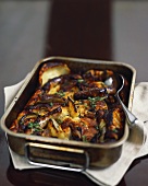 Potato bake with aubergines and sausages