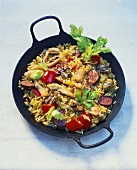 Paella with sausage, chicken and seafood
