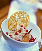 Cracker with crabmeat, soft cheese and pomegranate seeds