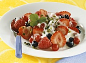Plate of berries with yoghurt and pistachios