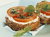 Toasted wholemeal roll with fresh cheese and tomatoes