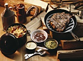 T-bone steak, various sauces and stew