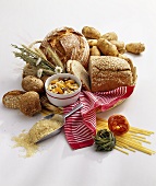 Still life with bread, potatoes, muesli, pasta & rice