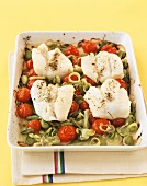 Oven-baked sea bass fillet with leeks and cherry tomatoes