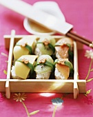 Sweet sushi with sesame and honey dip