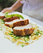 Roast pork with noodles and beans