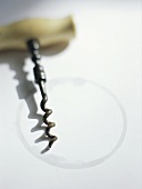 Corkscrew and ring left by a wine bottle