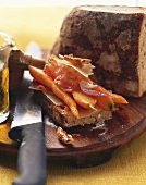 Toasted bread with carrots, bacon and cheese